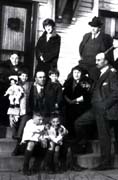 Floyd and Rita Dondanville and their family and three of Floyds siblings. (standing from left ):  Florence (16.8); Rita's father; Floyd and Rita; 	(seated) : Vern (16.9) with Helen and Bill; Ellie (16.3); below  Bob  and Floyd Jr. , Dwight, Illinois, circa 1924.