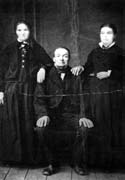 Michel Dontenville with his wife Marie Amie and daughter 	Julie (2.3) . St. Maurice, 1870s.